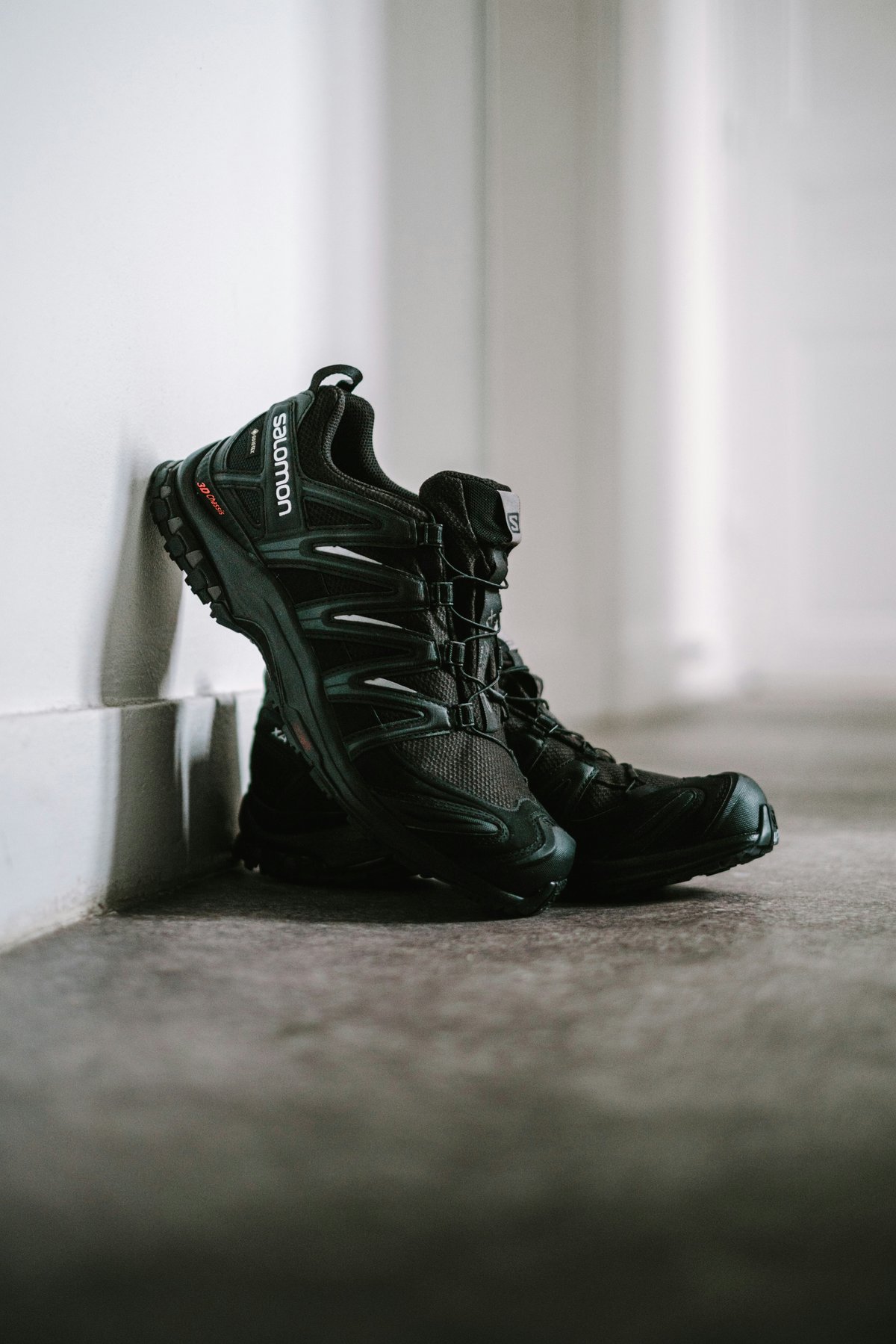 Salomon sneakers i moody editorial setting